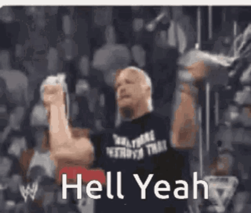 A Man In A Black Shirt Is Holding His Fist In The Air . GIF