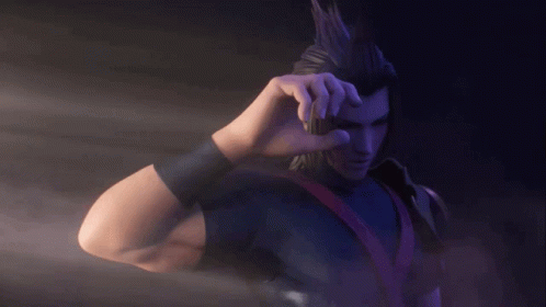 A Man In A Black Shirt Is Holding Something In His Hands GIF
