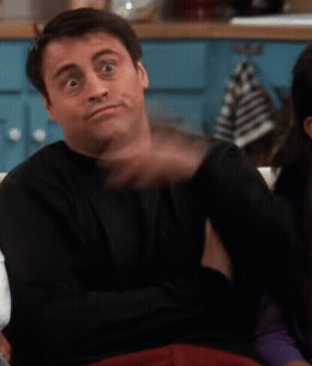 A Man In A Black Shirt Is Making A Face GIF