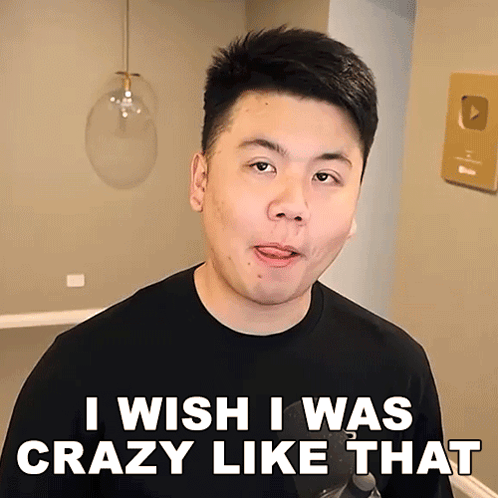 A Man In A Black Shirt Is Making A Funny Face And Says I Wish I Was Crazy Like That GIF