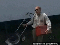 A Man In A Black Shirt Is Opening A Door GIF