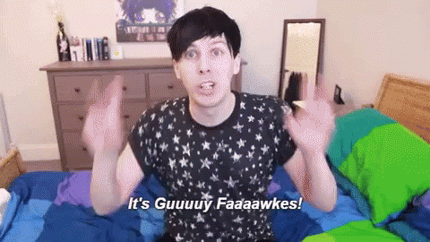 A Man In A Black Shirt Is Sitting On A Bed And Says It 'S Guuuy Faaaawkes GIF