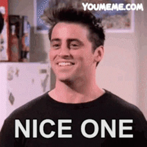A Man In A Black Shirt Is Smiling And Says Nice One On The Bottom GIF