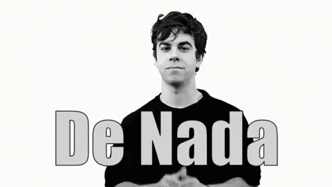 A Man In A Black Shirt Is Smiling In Front Of A White Background With The Words De Nada Written On It . GIF