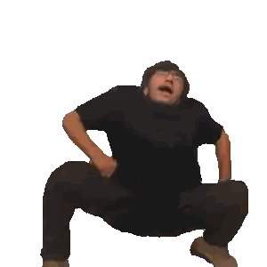 a man in a black shirt is squatting with his legs crossed