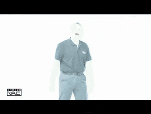 a man in a black shirt is standing in front of a white wall with the word vac written on it