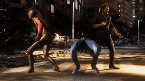 A Man In A Black Shirt Is Standing Next To A Spider Man GIF