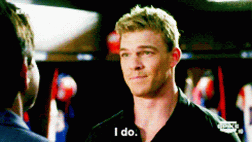 A Man In A Black Shirt Is Talking To Another Man And Says I Do GIF