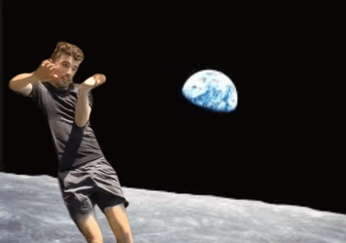 A Man In A Black Shirt Is Throwing A Ball With A Globe In The Background GIF