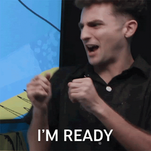 A Man In A Black Shirt Says I 'M Ready With His Fist In The Air GIF