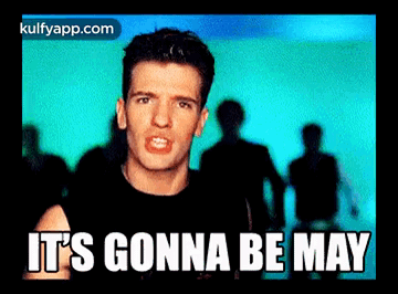 A Man In A Black Shirt Says It 'S Gonna Be May In Front Of A Crowd Of People GIF