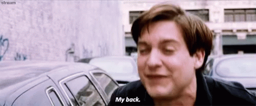 A Man In A Black Shirt Says " My Back " GIF