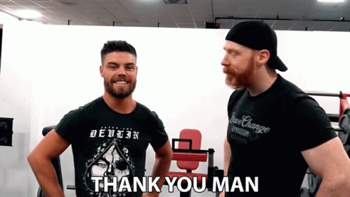 A Man In A Black Shirt Says Thank You Man To Another Man GIF