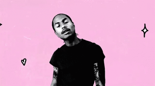 A Man In A Black Shirt Stands In Front Of A Pink Background That Says Some Times I Love You Too GIF