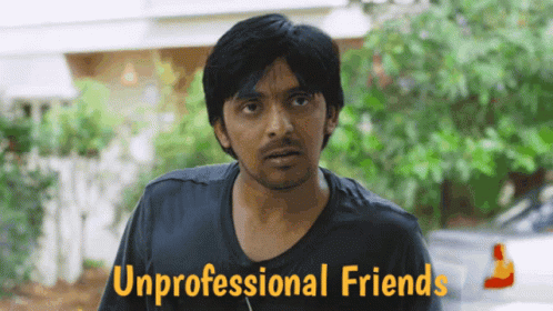 A Man In A Black Shirt Stands In Front Of A Sign That Says " Unprofessional Friends " GIF