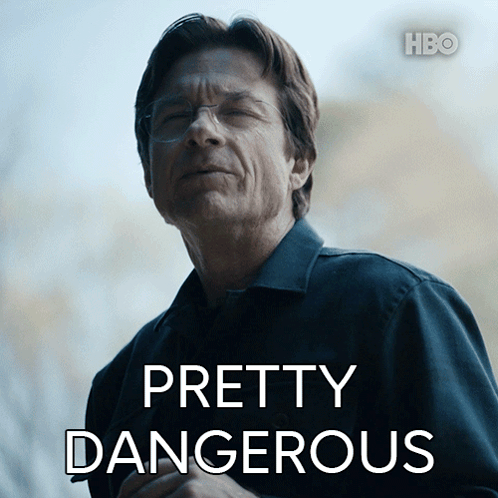 A Man In A Black Shirt With Pretty Dangerous Written On It GIF