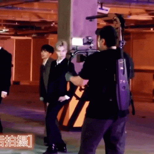 A Man In A Black Shirt With The Number T4 On The Back GIF
