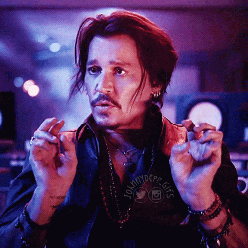 A Man In A Black Shirt With The Word Johnny Depp On It GIF