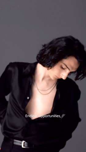 A Man In A Black Shirt With The Words Endless Opportunities On The Bottom Right GIF