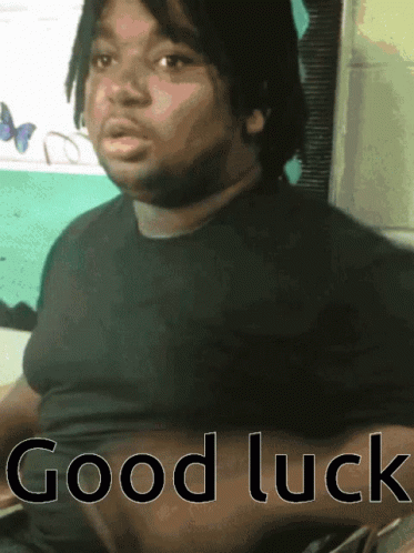 A Man In A Black Shirt With The Words Good Luck On The Bottom GIF
