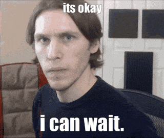A Man In A Black Shirt With The Words I Can Wait GIF