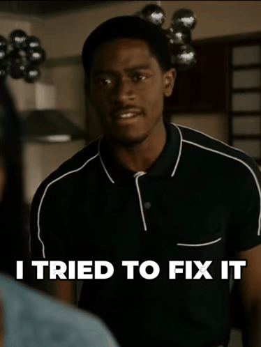 A Man In A Black Shirt With The Words I Tried To Fix It Above Him GIF