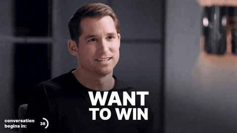 A Man In A Black Shirt With The Words Want To Win Above Him GIF
