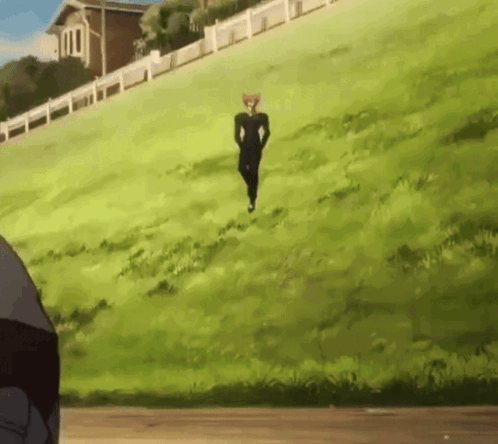 A Man In A Black Suit Is Running Up A Hill GIF