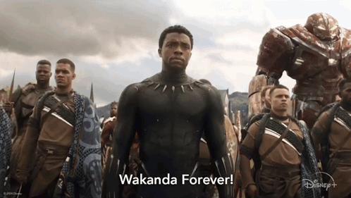A Man In A Black Suit Stands In Front Of A Group Of Soldiers And The Words Wakanda Forever GIF