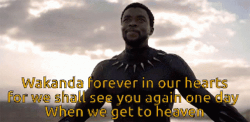 A Man In A Black Suit With The Words Wakanda Forever In Our Hearts GIF