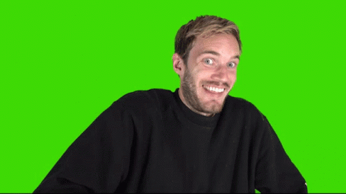A Man In A Black Sweater Is Making An Ok Sign On A Green Screen GIF