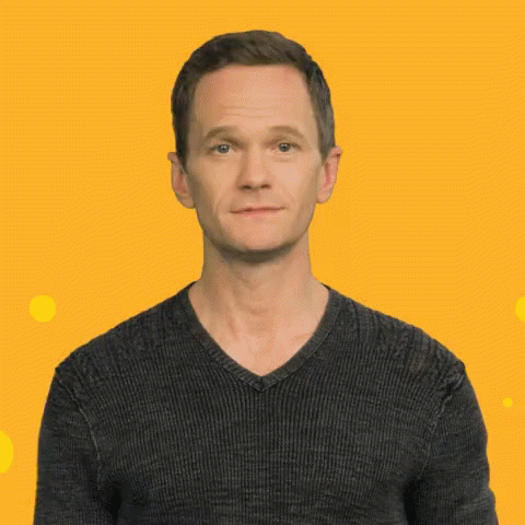 A Man In A Black Sweater Making A Funny Face GIF