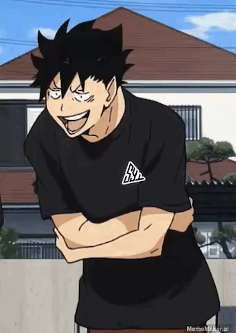 A Man In A Black T-Shirt Is Laughing With His Arms Crossed In Front Of A House . GIF