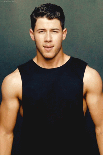 A Man In A Black Tank Top Has A Tattoo On His Arm That Says ' Amy ' GIF