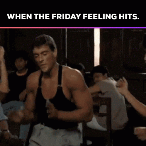 A Man In A Black Tank Top Is Dancing In A Bar While A Woman Looks On . GIF