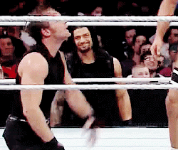 A Man In A Black Tank Top Is In A Boxing Ring GIF