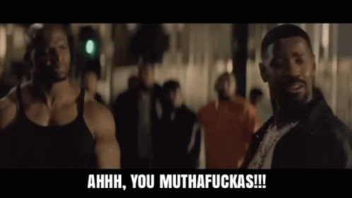 A Man In A Black Tank Top Is Laughing And Says Ahhh You Muthafuckas GIF