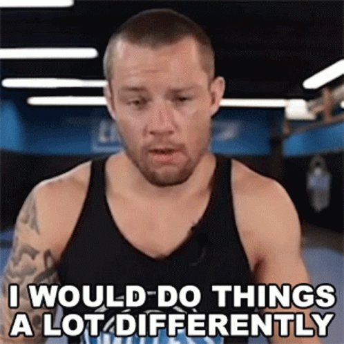 a man in a black tank top is saying " i would do things a lot differently "