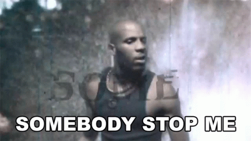 A Man In A Black Tank Top Is Standing In Front Of A Waterfall And Says `` Somebody Stop Me '' . GIF