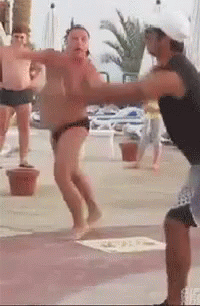 A Man In A Black Tank Top Is Standing Next To A Man In A White Hat . GIF