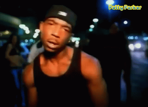 A Man In A Black Tank Top Says It 'S Murdaa GIF