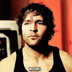 A Man In A Black Tank Top With The Word Wow Written On His Chest GIF
