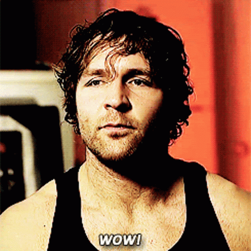 A Man In A Black Tank Top With The Words Wow Written On His Chest GIF