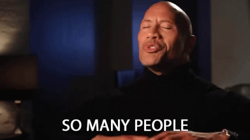 A Man In A Black Turtleneck Is Smiling And Says So Many People GIF