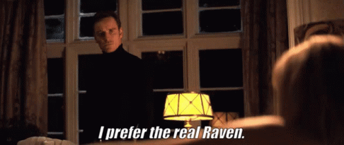 A Man In A Black Turtleneck Stands In Front Of A Lamp And Says I Prefer The Real Raven GIF