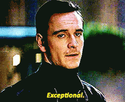A Man In A Black Turtleneck Sweater Says Exceptional GIF