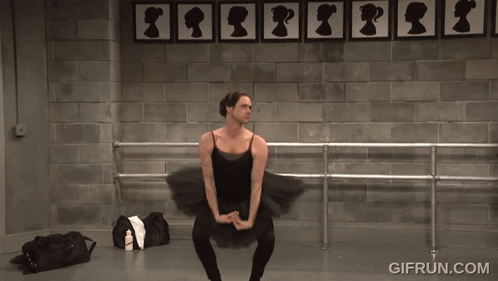 A Man In A Black Tutu Is Dancing In Front Of A Wall With Silhouettes Of Women On It GIF