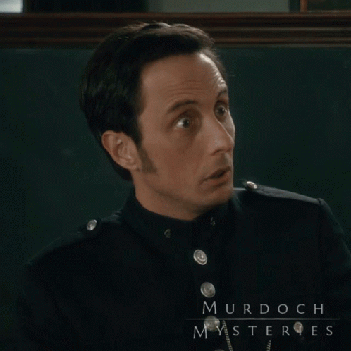 A Man In A Black Uniform With Murdoch Mysteries Written On It GIF