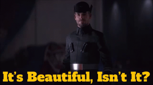 A Man In A Black Uniform With The Words It 'S Beautiful Isn 'T It On The Bottom GIF