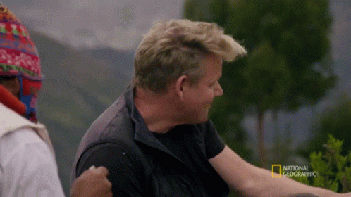 A Man In A Black Vest Is Being Interviewed By National Geographic GIF